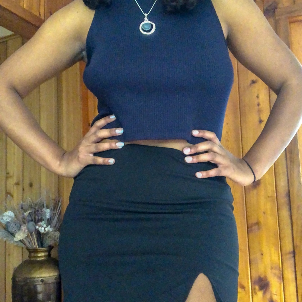 Short black mini skirt with a small slit